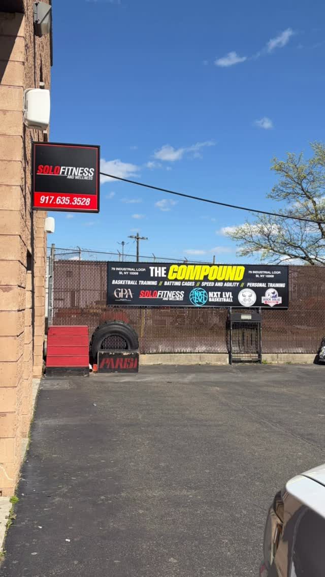 The Compound outdoor fence banner